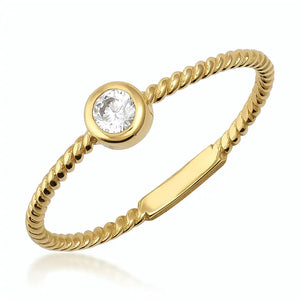 A refined 14K solid gold ring showcases a minimalist rope design and features a central round diamond in a bezel setting. Set against a plain white background, it exudes both elegance and simplicity.