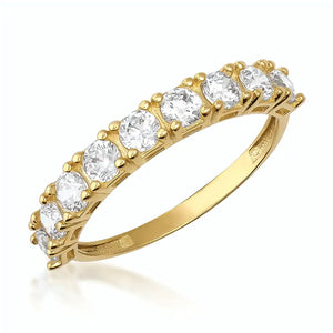 A 14K solid gold wedding ring from the Tennis Cubic Zirconia Band collection featuring a row of sparkling cubic zirconia stones, each held by prongs, elegantly showcased against a plain background.