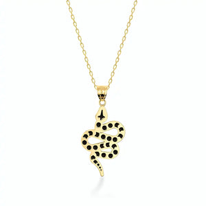 The 14K Solid Gold Snake Necklace features a pendant that beautifully resembles a coiled serpent with intricate black spots. This elegant charm is suspended from a fine chain, set against a plain white background, creating an outstanding piece of jewelry.