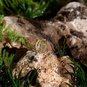 Discover the elegance of the 14K Solid Gold Blossom Green Gemstone Ring from the Into the Woods Collection by Erdem Akan. This exquisite piece boasts a textured double-band design adorned with small, round green gemstones set along both bands, showcasing Erdem Akan's dedication to craftsmanship and sustainable practices.