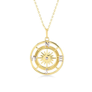 Introducing the 14K Gold Compass Necklace from RundaJewelryUs, featuring a circular pendant with an exquisite sunburst design at its center. This elegant piece is adorned with the letters N, E, S, and W to indicate cardinal directions, making it an ideal travel accessory for adventure seekers or a perfect graduation gift.