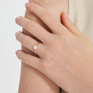 Explore the 14K Solid Gold Natural Pearl Ring from the Elegance Collection, featuring a natural real pearl gracefully set atop a uniquely designed band with small rectangular cutouts.