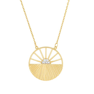 Introducing the 14K Solid Gold Sunrise Necklace from the Helios Collection, this exquisite piece features a pendant shaped like a stylized rising sun. Its radiant rays are artfully crafted with gold lines, while lab-grown diamonds elegantly form the center. The delicate hypoallergenic chain seamlessly complements this stunning pendant.