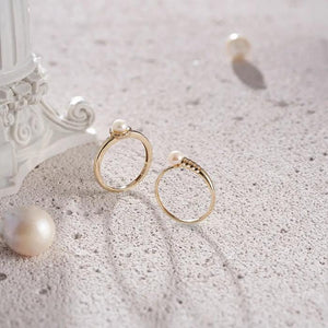 Explore the 14K Solid Gold Natural Pearl Ring from the Elegance Collection, featuring a natural real pearl gracefully set atop a uniquely designed band with small rectangular cutouts.