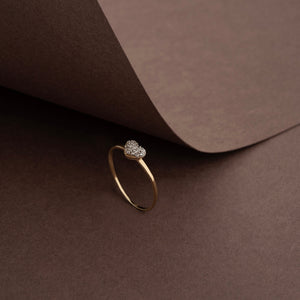 Introducing the 14K Solid Gold Heart Shaped Gemstone Ring, featuring a stunning heart-shaped design adorned with small, sparkling cubic zirconia gemstones on a pristine white backdrop.