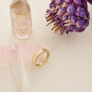 Featuring a bold vintage design, the 14K Solid Gold Dome Ribbed Ring showcases a textured exterior with a ribbed pattern. Part of the Charlotte Line collection, this ring includes a lattice-patterned interior and offers a shiny, polished finish that enhances its elegant and stylish appeal.