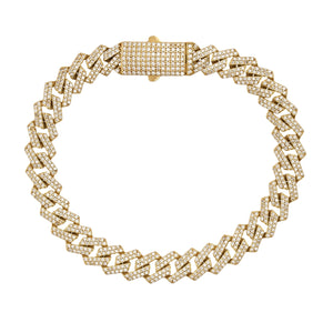 A 14K real gold Cuban link chain bracelet showcasing a thick, interlocking pattern adorned with cubic zirconia stones and featuring a rectangular, diamond-studded clasp.