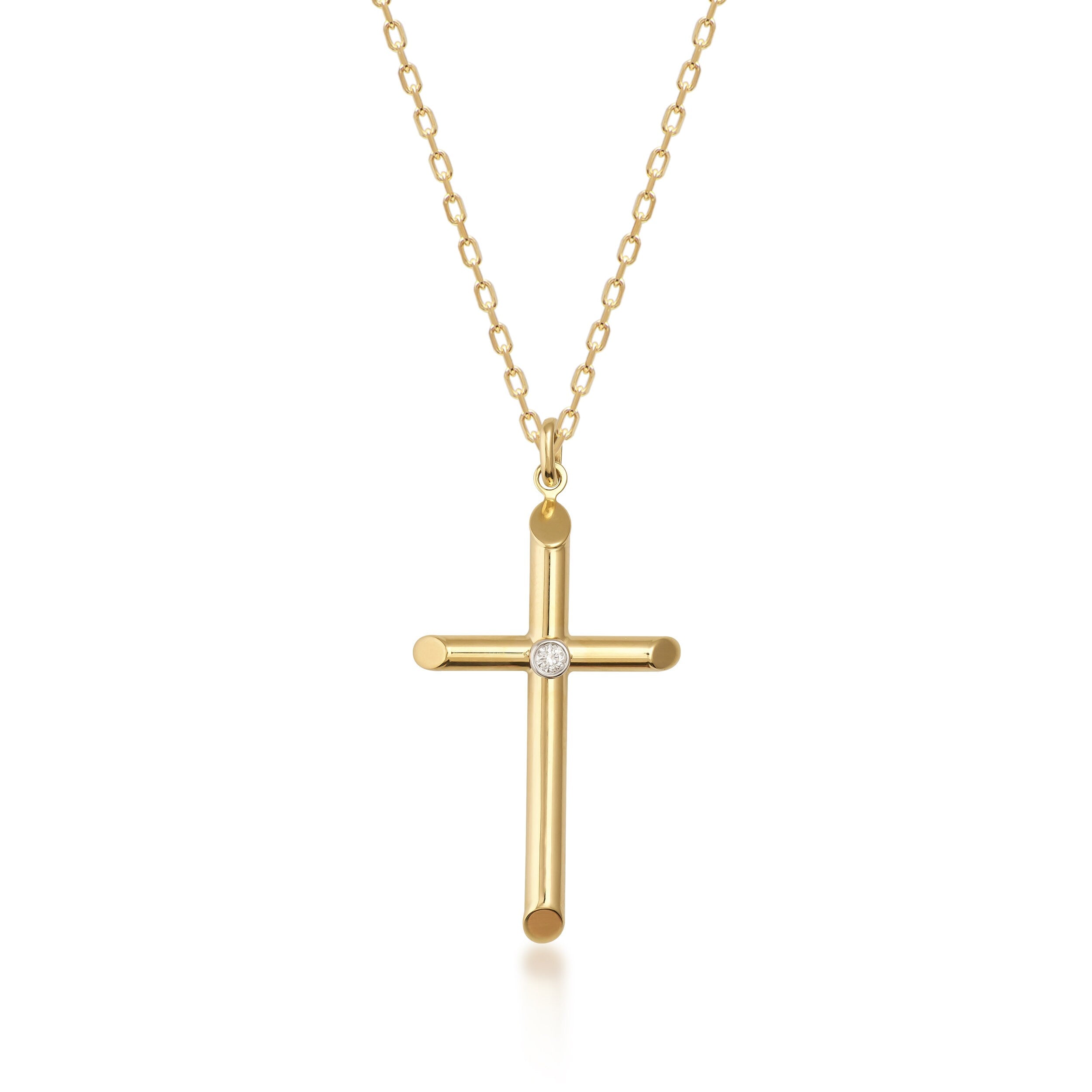 The 14K Real Gold Cross Pendant Necklace in medium size features a single diamond in the center on a delicate gold chain, beautifully set against a white background. Ideal for those cherishing their Christian faith, it also makes an exquisite baptism gift.