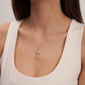 The 14K Real Gold Cross Pendant Necklace in medium size features a single diamond in the center on a delicate gold chain, beautifully set against a white background. Ideal for those cherishing their Christian faith, it also makes an exquisite baptism gift.