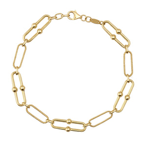 The 14K Real Solid Gold Paperclip Chain Bracelet features a beautiful design with alternating Italian paperclips and small round beads. Its rope-like textured links offer a chic and elegant look, all securely fastened with a lobster clasp.