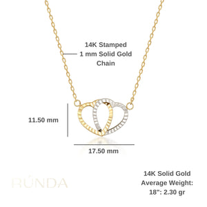 Presenting the exquisite 14K Solid Gold Interlocking Hearts Necklace, featuring two interwoven heart pendants—one crafted in gold and the other in silver—beautifully showcased against a simple white background. This necklace is an ideal couple's gift, representing unity and love.