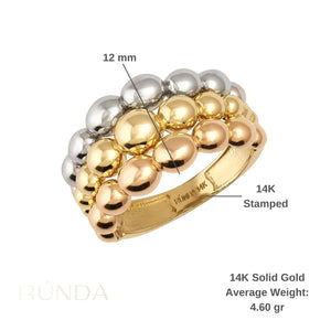 The 14K Solid Gold Chunky Tri-Color Bubble Ring is a statement wedding band featuring chunky bands of silver, gold, and rose gold. Its modern rounded design includes an engraved 14K mark on the gold band.