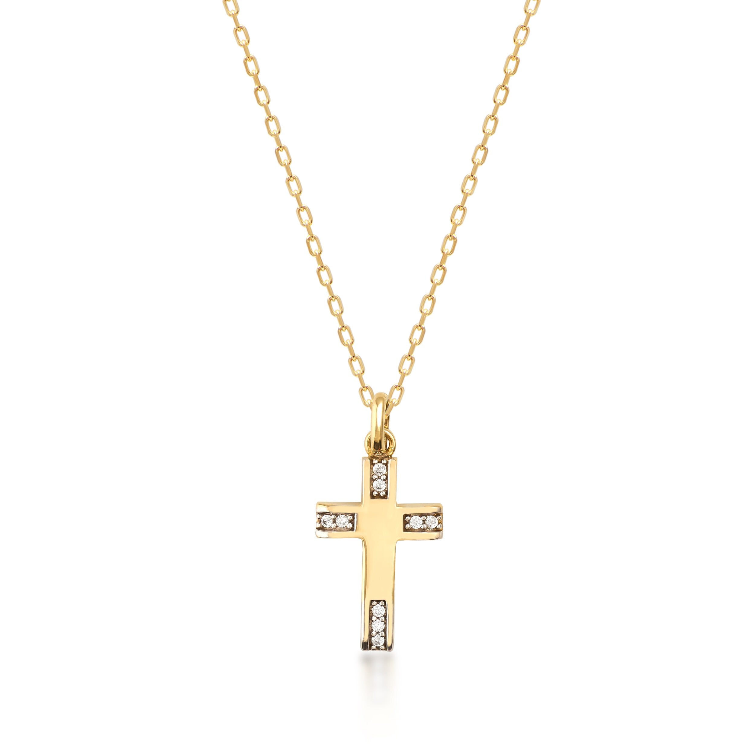 The 14K Solid Gold Tiny Minimal Cross Necklace, featuring a gold chain and a cross pendant embellished with small white gemstones, exudes elegance. The simple white background highlights its delicate design, making it a perfect piece of religious jewelry or a meaningful Christian faith gift.