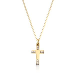 The 14K Solid Gold Tiny Minimal Cross Necklace, featuring a gold chain and a cross pendant embellished with small white gemstones, exudes elegance. The simple white background highlights its delicate design, making it a perfect piece of religious jewelry or a meaningful Christian faith gift.