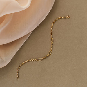 Introducing the 14K Real Solid Gold Paperclip Rolo Chain Bracelet, showcasing a sophisticated blend of small interlocking chains and larger oval links. The bracelet is secured with a lobster clasp closure, offering a chic and elegant design reminiscent of Italian paperclips for a modern and fashionable appearance.