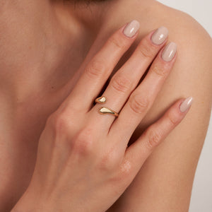 The 14K Solid Gold Dome Open Band is a sleek ring with smooth, rounded ends and an inner band adorned with a textured lattice pattern. Its polished finish enhances the modern design perfectly.