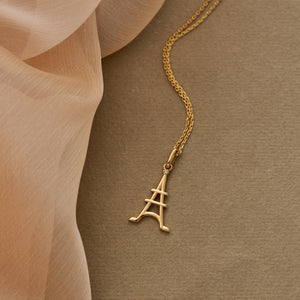 The 14K Solid Gold Minimal Eiffel Tower Pendant Necklace radiates Parisian charm with its elegant design.