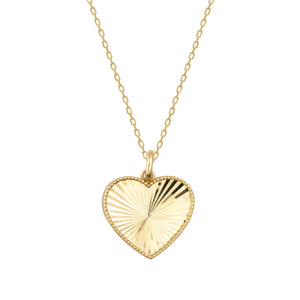 Introducing the 14K Solid Gold Vintage Sunburst Striped Pendant Necklace, featuring a stunning heart-shaped charm. The textured design of this handmade pendant is elegantly attached to a fine gold chain, all beautifully displayed against a plain white background.