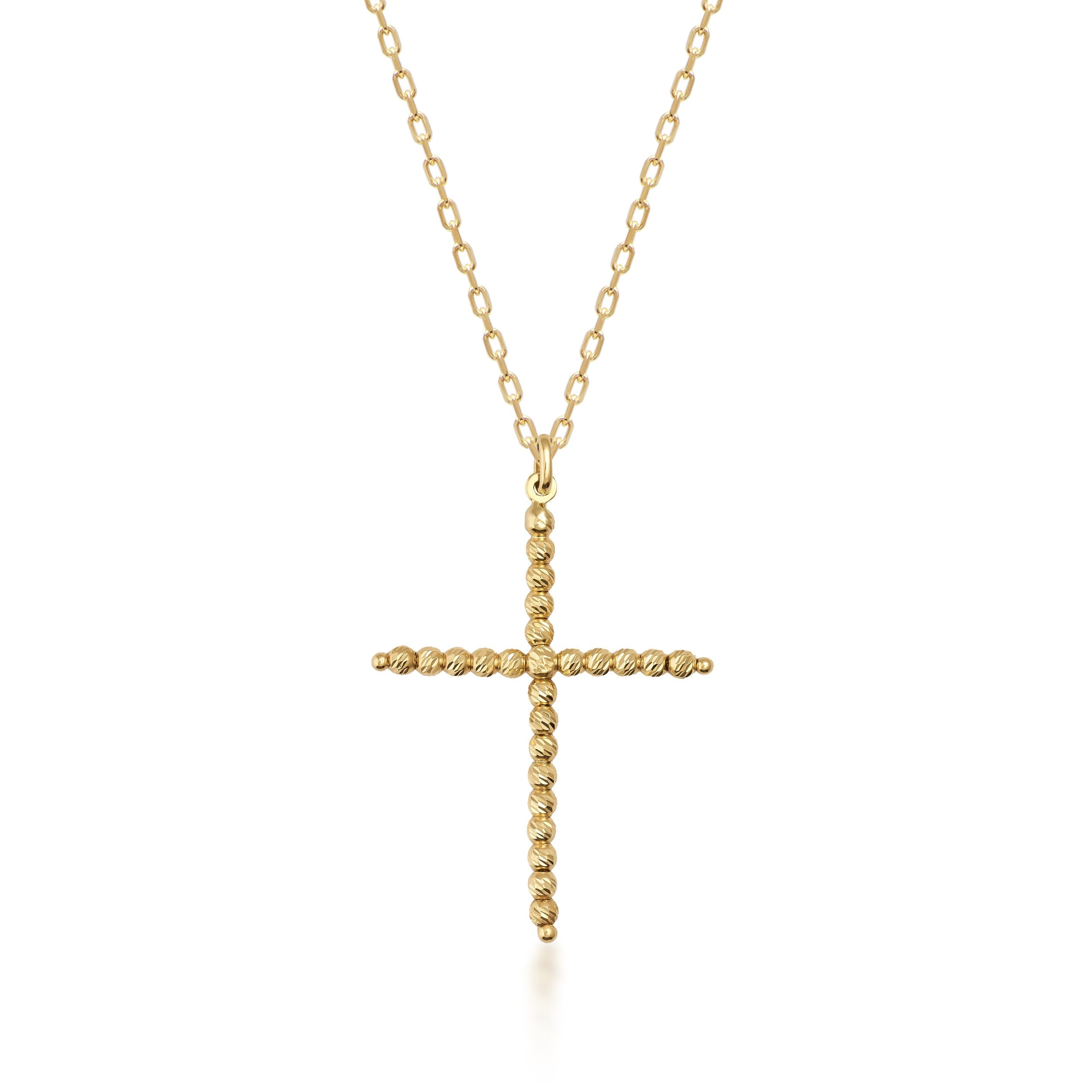 Introducing the 14K Solid Gold Dorika Beaded Cross Pendant Necklace—a masterfully crafted piece that features a religious cross pendant made from twisted gold. This textured design is enhanced with delicate Dorika beads, showcasing its simple yet elegant craftsmanship.