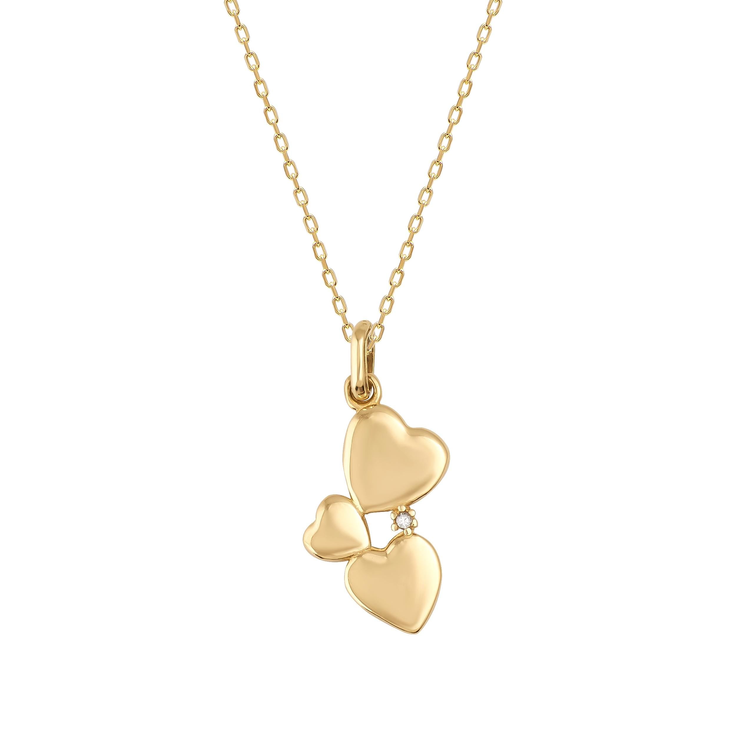 The 14K Solid Gold Minimal Heart Pendant Necklace showcases three interconnected heart shapes in varying sizes, intricately crafted in solid gold. This elegant pendant is suspended from a delicate gold chain, exuding simplicity and sophistication.