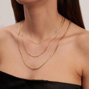 A white background showcases the 14K Real Solid Gold Miami Cuban Curb Link Chain Necklace, featuring three parallel chains with round, interlocking links and a secure lobster clasp.