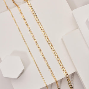 A white background showcases the 14K Real Solid Gold Miami Cuban Curb Link Chain Necklace, featuring three parallel chains with round, interlocking links and a secure lobster clasp.