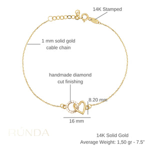 The 14K Solid Gold Minimal Heart and Circle Interlocking Bracelet highlights a delicate design with heart-shaped and circular pendants, the latter adorned with small white stones. This handmade jewelry piece features an adjustable chain and a lobster clasp closure.