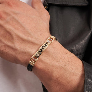 Introducing the 14K Real Solid Gold & Braided Leather Black Cord Bracelet for Men, featuring a stunning decorative gold centerpiece with X-shaped cutouts. Accentuated with gold details and a striking onyx gemstone, this sophisticated piece is completed with a secure clasp closure.