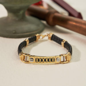 Introducing the 14K Real Solid Gold & Braided Leather Black Cord Bracelet for Men, featuring a stunning decorative gold centerpiece with X-shaped cutouts. Accentuated with gold details and a striking onyx gemstone, this sophisticated piece is completed with a secure clasp closure.