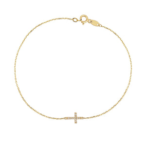 The 14K Solid Gold Tiny Diamond Cross Bracelet for Women showcases a refined design with a small horizontal cross charm embellished with delicate, sparkling stones, all linked by a slender chain and secured with a spring ring clasp.