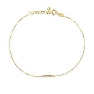 The Diamond Bar Bracelet in 14K Solid Gold for Women is an exquisite piece, featuring a delicate chain with a small rectangular bar embellished with tiny gemstones. It includes an adjustable closure with several loops to ensure a perfect fit, highlighting the elegance and allure of genuine gold.