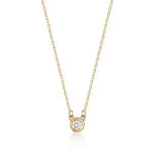 The 14K Solid Gold Diamond Solitaire Bezel Necklace is a beautifully crafted piece featuring a round, bezel-set diamond pendant. Made with genuine diamonds and set on a 14K solid gold fine chain, this necklace exudes simplicity and elegance, making it ideal for both everyday use and formal occasions.