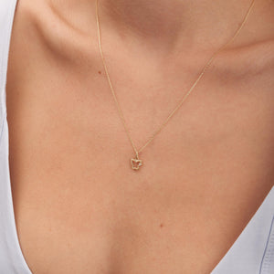 The 14K Solid Gold Natural Real Diamond Butterfly Necklace for Women showcases a delicate butterfly-shaped pendant in genuine 14K gold, featuring a real diamond on one wing. The design is simple and elegant, with a fine chain that accentuates the detailed pendant.