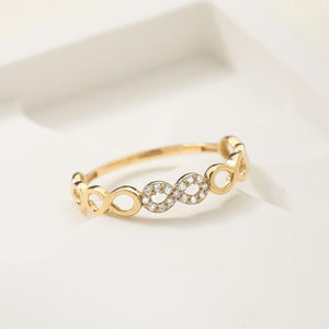 The 14K Solid Gold Diamond Infinity Ring for Women showcases a sophisticated and stylish eternity loop design, adorned with sections encrusted in small natural diamonds, all crafted from genuine 14K solid gold.