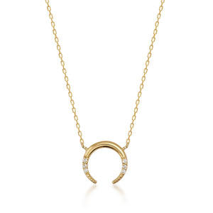 The Diamond Crescent Moon Pendant Necklace in 14K Solid Gold is a refined piece crafted from authentic gold. It showcases a crescent moon pendant embellished with tiny natural diamonds. The slender, graceful chain beautifully accentuates the moon's design, providing an essence of sustainable jewelry luxury.