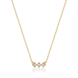 The Natural Diamond Solid 14K Minimal Dainty Trio Necklace is an elegant piece, showcasing a thin chain made from solid gold and accented at the center with three small natural diamond stones set closely together.