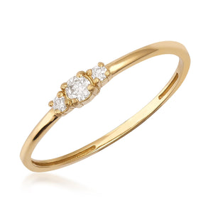 The 14K Solid Gold Diamond Promise Ring features a slim band with three round, sparkling natural diamonds set centrally, highlighting the brilliance of the stones in its simple yet elegant design.