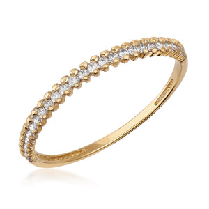 A 14K solid gold ring for women, featuring a single row of sparkling natural diamonds along the top, showcases an elegant and luxurious design.