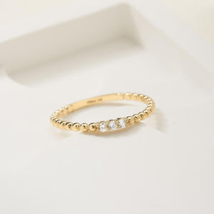 The 14K Gold Minimal Trio Stone Natural Diamond Ring showcases three small natural diamonds on a delicate beaded band.