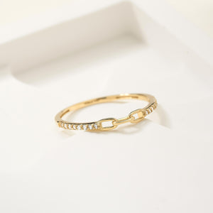 This genuine 14K solid gold piece features a chain-link design surrounded by small natural diamonds. The delicate item, named the Diamond Chain & Paperclip Ring, has a smooth finish, showcasing elegance and style with its hallmark of quality.