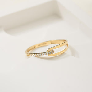 A gold ring for women, designed like a nail, made of 14K solid gold with a row of natural diamonds along the top.