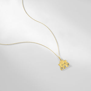 A delicate 14K gold necklace featuring a pendant of a cat family, expertly crafted in shining metal.