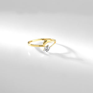 The 14K Gold Moon and Star Ring features a sleek, minimalist design with smooth curves, showcasing a crescent moon alongside a star-shaped gem. Set against a plain white background, it is hypoallergenic jewelry that combines elegance with comfort.