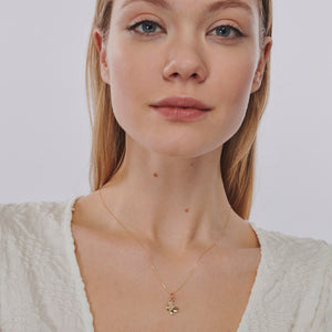 Introducing the 14K Gold Butterfly Necklace, a hypoallergenic piece crafted with a delicate chain and adorned with a small, lustrous butterfly pendant that hangs gracefully at the center. The sleekly designed butterfly features gently open wings, adding to its elegant charm.