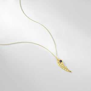 The 14K Gold Angel Wing Pendant Charm Necklace features a captivating angel wing pendant with an eye motif at its center, elegantly suspended from a delicate chain against a pristine white backdrop. This necklace is hypoallergenic and radiates elegance.