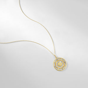 Introducing the 14K Gold Compass Necklace from RundaJewelryUs, featuring a circular pendant with an exquisite sunburst design at its center. This elegant piece is adorned with the letters N, E, S, and W to indicate cardinal directions, making it an ideal travel accessory for adventure seekers or a perfect graduation gift.