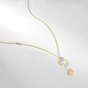 The 14k Solid Gold Tree of Life Y Necklace by RundaJewelryUs is a minimalist and elegant piece, featuring a delicate thin chain with a small circle pendant. A tree of life charm hangs below, and the addition of a tiny embedded gemstone on one side adds subtle sophistication to the design.