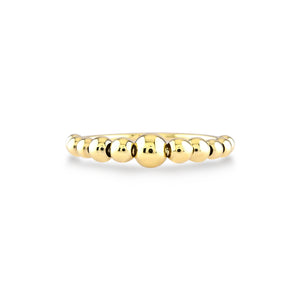 The 14k Gold Bubble Ring features a series of polished, spherical beads, resulting in a delicate and elegant design. This handcrafted piece boasts a smooth finish with a simple yet stylish look, beautifully highlighted against a plain white background to emphasize its genuine allure.