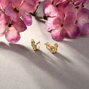 Presenting the 14K Solid Gold Butterfly Wing Stud Earrings from RundaJewelryUs, these minimalist earrings feature sparkling gemstones along the wings and a smooth, polished finish. The elegant butterfly design is complemented by a simple stud back for secure fastening.