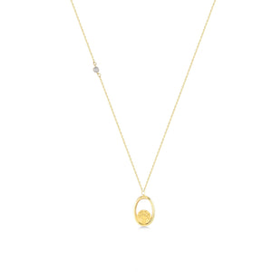 Introducing the 14K Real Gold Tree of Life Necklace: This exquisite piece showcases a delicate chain adorned with an oval-shaped pendant. Within the pendant lies a beautifully textured gold design, echoing the timeless Tree of Life motif. A small lab-created diamond accent graces one side of the chain, elegantly set against a simple white background.